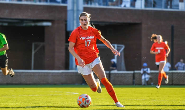 Virginia women's soccer forward Haley Hopkins dribbles the ball against North Carolina.